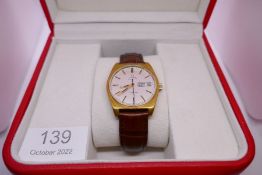 OMEGA; a boxed gent's 'Omega' Automatic Geneve wristwatch, with circular champagne dial, baton marki