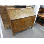 An antique North Italian bureau having 2 serpentine drawers with all over chequered decoration, 96cm