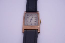 Vintage 9ct gold cased gents watch on black leather strap, cased marked London DBS, with original gu
