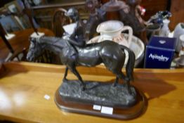 A Bronze style figure of horse and jockey