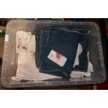 A box of vintage linen, including tablecloths, etc