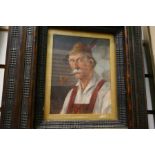 An antique continental oil portrait of man smoking pipe, probably Bavarian or Austrian, in cushion s