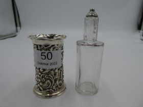 A scent bottle having a silver pierced cover and silver knop. Hallmarked Chester 1901 Henry Matthews