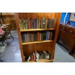 Three shelves of assorted books, some antiquarian