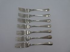A set of seven smaller silver forks by Walker and Hall, Sheffield 1934 engraved handle ends, 11.67oz