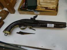 An early 19th Century Flintlock pistol having brass decoration, AF