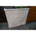 An old painted pine chest having two short and three long drawers on plinth base