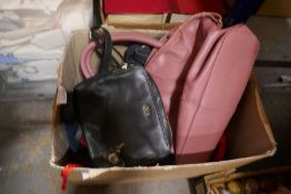 A box of vintage handbags from various manufacturers