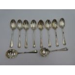 A set of eight silver dessert spoons having rat tail design. Hallmarked Sheffield 1934 Walker and Ha