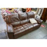 A modern brown leather settee