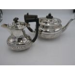 A silver teapot having half reeded body and reeded borders, inscribed London 1891 Josiah Williams an