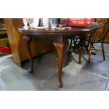 An early 20th Century mahogany extending dining table having 1 leaf