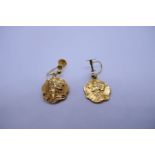 Pair of 9ct yellow gold screw on earrings each hung with a gold panel depicting a Grecian lady, mark