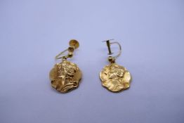 Pair of 9ct yellow gold screw on earrings each hung with a gold panel depicting a Grecian lady, mark