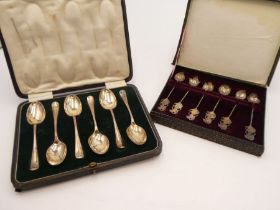 A cased set of decorative silver small teaspoons having various ornate bowls, Wrythen handles and fi