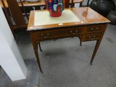 A small Edwardian inlaid mahogany writing table with letter and stationery compartment