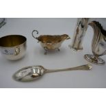 A very pretty sugar sifter having cylindrical body and ornate, pierced top by Cooper Brothers and So