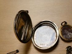 A large oval Silver locket, a plated Mourning locket, etc