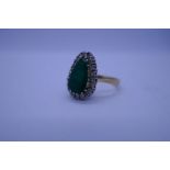 18ct yellow gold ladies ring, with central pear shaped emerald, surrounded approx 20 round cut diamo