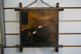 An early 20th century bamboo triptych mirror decorated oriental figures and cranes