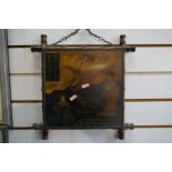 An early 20th century bamboo triptych mirror decorated oriental figures and cranes