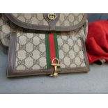 GUCCI; a satchel bag and a matching purse