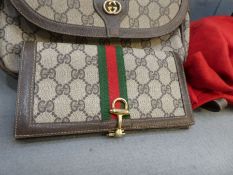 GUCCI; a satchel bag and a matching purse