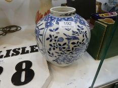 A 19th Century Chinese blue and white jar/vase decorated flowers and foliage, mark to base, 19cms