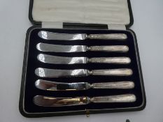 Two cased sets of six silver handled knives, one hallmarked Sheffield 1917 John Biggin. The other ha