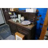 A reproduction Oak sideboard, having raised back