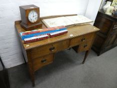 An Arts and Crafts oak desk having four drawers, (the top drawers stamped with registered number), 1