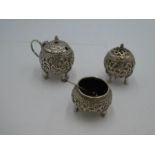 A set of probably Indian white metal salts and a pepper. Of spherical design having decorative chase
