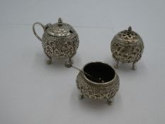 A set of probably Indian white metal salts and a pepper. Of spherical design having decorative chase