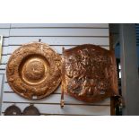 A selection of copper trays, wall plaques and a Fire Guard in Arts and Crafts style