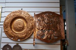 A selection of copper trays, wall plaques and a Fire Guard in Arts and Crafts style