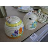 Clarice Cliff; a Crocus design honey pot and a similar Honeydew example (chip to base on Crocus pot)