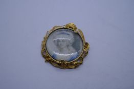 Antique yellow gold circular pendant, possibly 18ct with miniature of a lady and mother of pearl cir