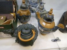 Five decorated teapots; one by Lonkey Moor Pottery of a dragon