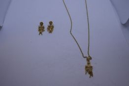 Pair of 18ct yellow gold earrings with screw on backs, with matching pendant hung on a fine 18K gold