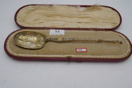 A highly decorative and impressive gilt spoon having long handle with Wrythen design at the end, ter