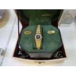 A jewellery box containing various vintage watches, costume jewellery and a Dufonte plated wristwach
