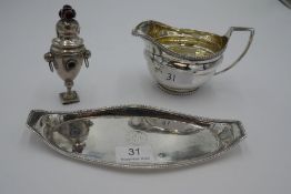 A Georgian silver milk jug having gilt interior and gadrooned borders. Hallmarked London 1804, maker