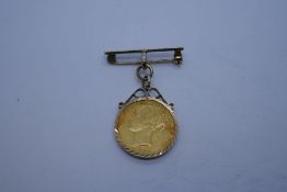 22ct Full Sovereign dated 1856, Young Victoria and Shield back, in a 9ct gold mount suspended on 9ct