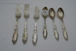 A small quantity of Gorham silver to include three spoons and three forks. Decorative handles having