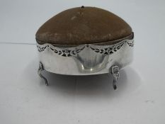 A 20th century silver pin cushion with a domed, hinged lid which opens to reveal a lined interior. W
