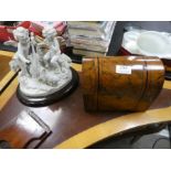 A Victorian Burr Walnut domed top tea caddy, a Cherub figure group and a rosewood book trough