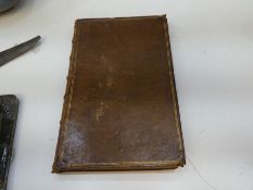 An early 18th Century leather bound book on the Art of Surveying and Measuring of Land, by John Love