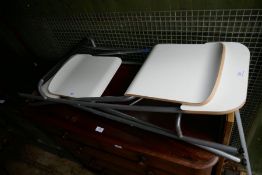 A pair of Ikea folding bar stools