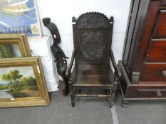 A reproduction oak open armchair having carved back