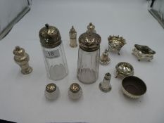 Two silver lidded glass sugar sifters one by Robert Pringle and Sons. Also with a selection of salt